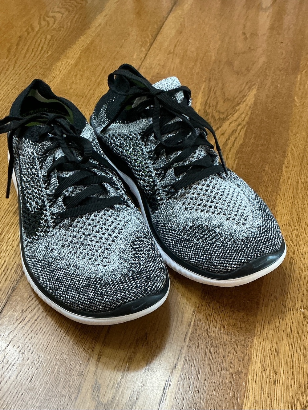Woman’s Nike Free Run Flyknit black/grey sneaker. Size 7. Black laces. like new!